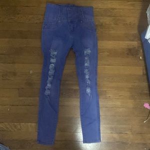 Bright blue jeans with rips, and 3 buttons,new never used